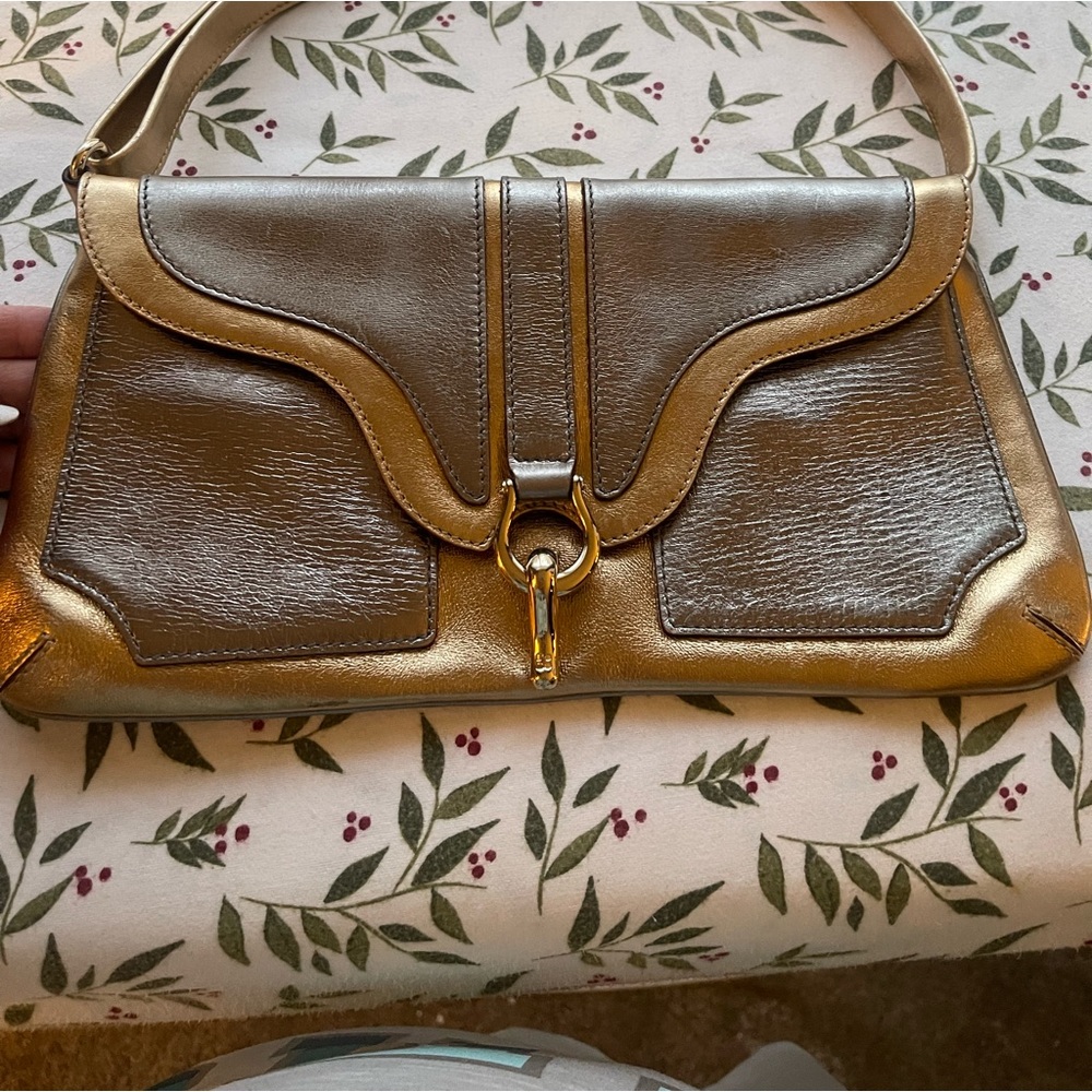 gently used but still very good condition night shoulder silver/gold bag